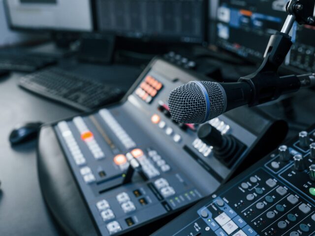 close-up-view-radio-mixing-desk-with-professional-sound-equipment-scaled (1)